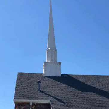 Roofing repairs on a church from storm damage in DFW