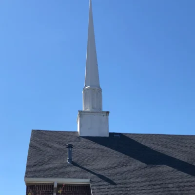 Roofing repairs on a church from storm damage in DFW