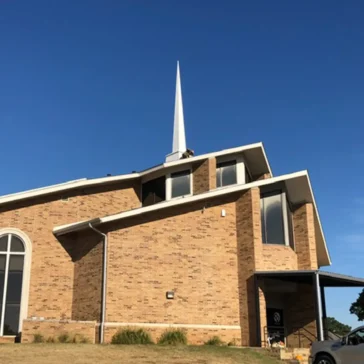 Roofing repairs on a church from storm damage in DFW