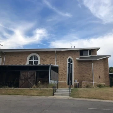 Roofing repairs on a church from storm damage in DFW